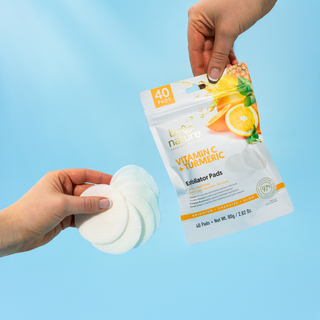 Exfoliator pads with packaging against a blue background