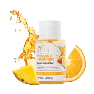 Bottle of 'by Nature' Vitamin C + Turmeric Liquid Exfoliator with orange and pineapple slices on a white background