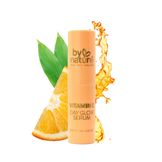 Vitamin C day glow serum with an orange and green leaf on a white background